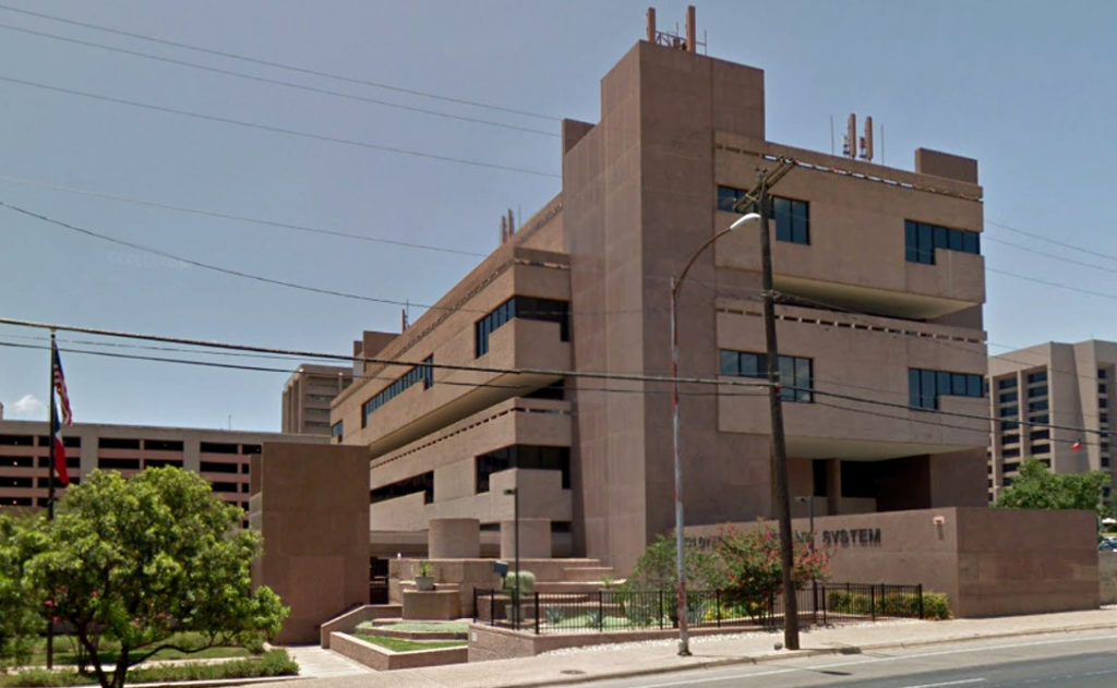 A small one-story annex building, seen partially to the left of the main building, will be demolished to make way for the project. Google Street View image.