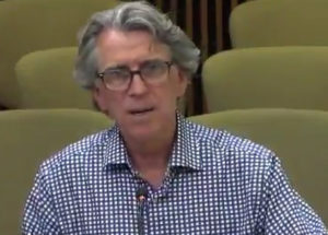 City planner Alan Holt speaking before the Design Commission. Image: City of Austin video archives.